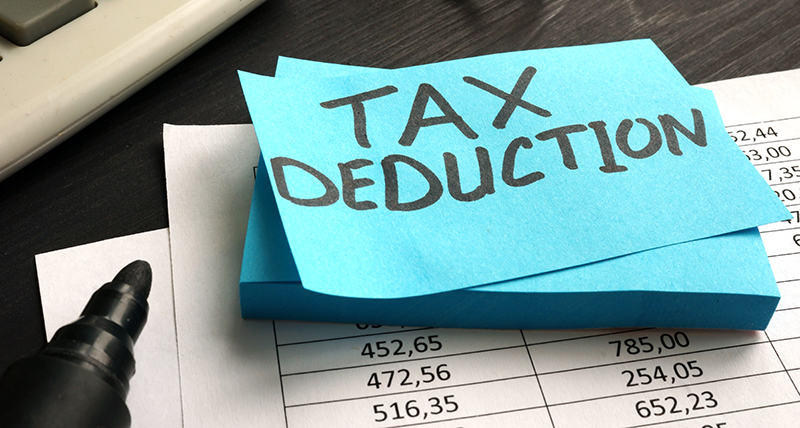 Tax Deduction written on a sticky-note