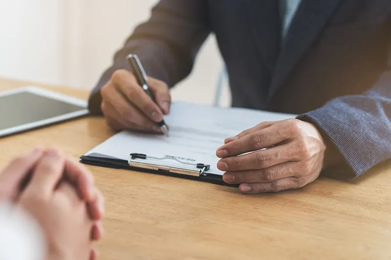 hand signing paperwork