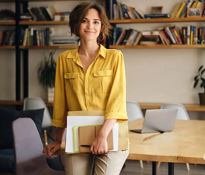 woman leaning against desk