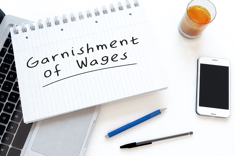 Garnishment of Wages written on a notepad
