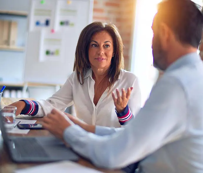 Two tax professionals discussing a case