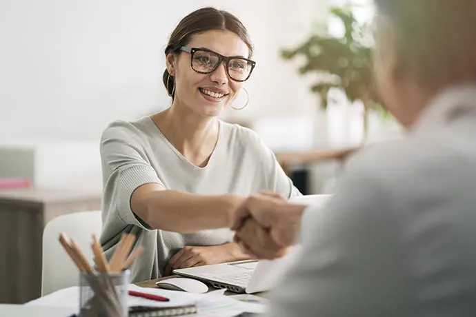 Woman shaking hands with tax professional