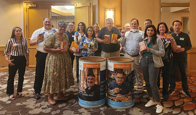 Group of TaxAudit Employees with Donation Bins in Front
