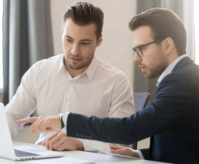 Two tax professionals discussing a case